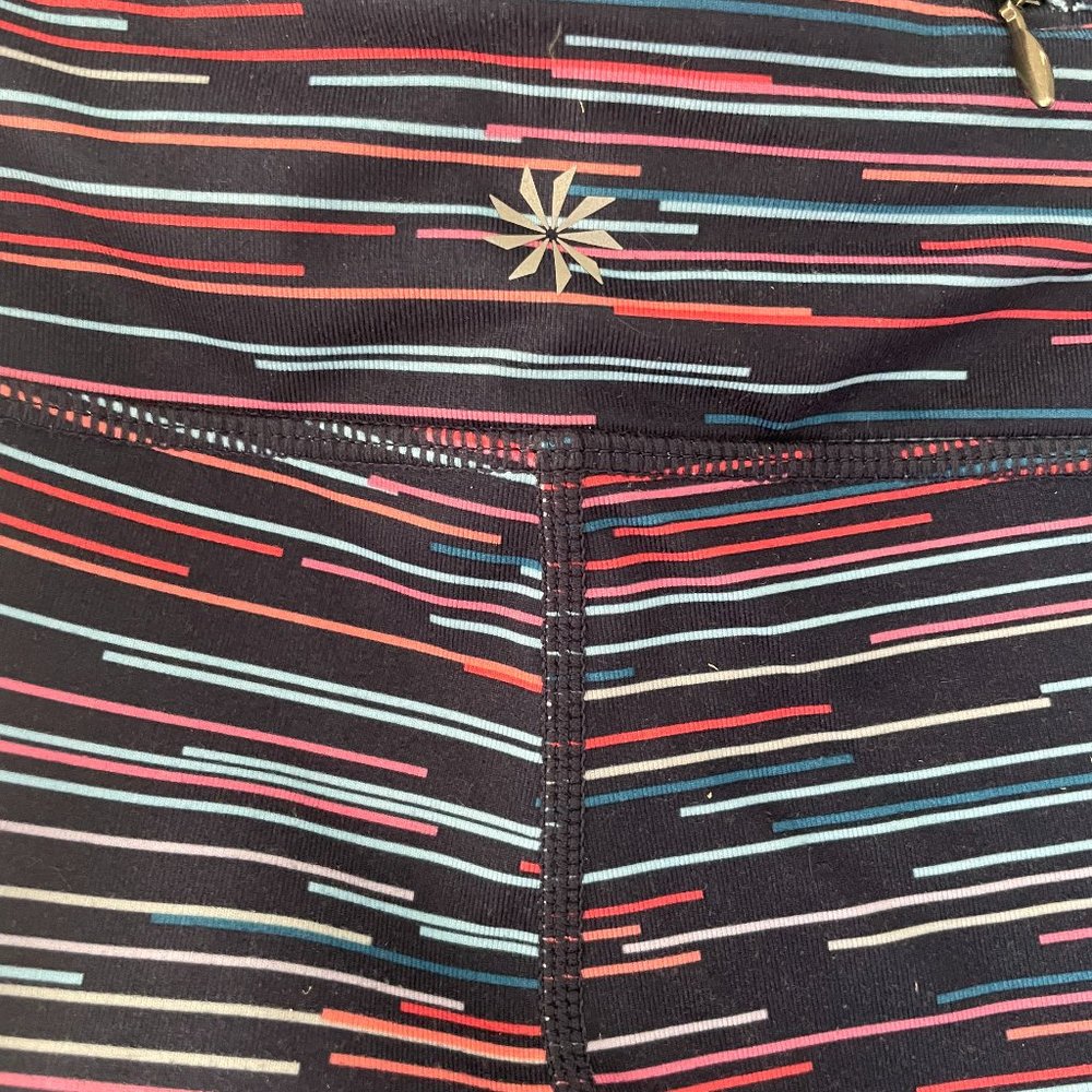 Athleta tights with stash pockets, navy with horizontal stripes, size M